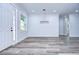 Bright dining room features wood-look floors and modern chandelier at 3125 Downing St, Clearwater, FL 33759