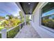 Covered porch with ceiling fan, tile flooring, and a view of the street at 3125 Downing St, Clearwater, FL 33759