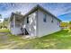 Exterior view of house with covered porch and stairs at 3125 Downing St, Clearwater, FL 33759