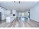 White kitchen with stainless steel appliances and large island at 3125 Downing St, Clearwater, FL 33759