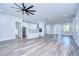Modern kitchen with white cabinets, island, and stainless steel appliances at 3125 Downing St, Clearwater, FL 33759