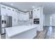 Modern kitchen with white cabinets, stainless steel appliances, and quartz countertops at 3125 Downing St, Clearwater, FL 33759