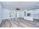 Modern white kitchen with island and stainless steel appliances at 3125 Downing St, Clearwater, FL 33759