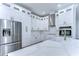 Modern kitchen with white cabinets, stainless steel appliances, and quartz countertops at 3125 Downing St, Clearwater, FL 33759