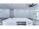 Modern kitchen with white cabinets, stainless steel appliances, and quartz countertops at 3125 Downing St, Clearwater, FL 33759