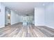 Open living room showcasing wood-look floors and modern ceiling fan at 3125 Downing St, Clearwater, FL 33759