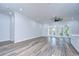 Spacious living area with wood-look floors and French doors at 3125 Downing St, Clearwater, FL 33759