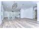 Spacious living room with wood-look floors and access to a patio at 3125 Downing St, Clearwater, FL 33759