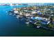 Aerial view showcasing a waterfront home and community at 380 Belle Point Dr, St Pete Beach, FL 33706