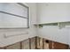 Small bathroom with shelf and water damage at 380 Belle Point Dr, St Pete Beach, FL 33706