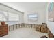 Spacious bedroom with large window and a dresser, under renovation at 380 Belle Point Dr, St Pete Beach, FL 33706
