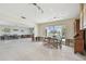 Kitchen dining area with water views and access to a deck at 380 Belle Point Dr, St Pete Beach, FL 33706