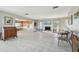 Bright living area with a fireplace and views into the kitchen and dining areas at 380 Belle Point Dr, St Pete Beach, FL 33706