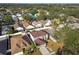 Aerial view showing a two-story house with a red tile roof amongst other houses at 6213 Venezia Pl, Riverview, FL 33578