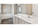 Bathroom with vanity, sink and garden tub at 6213 Venezia Pl, Riverview, FL 33578
