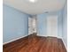 Bedroom with wood floors,door to bathroom and double door closet at 6213 Venezia Pl, Riverview, FL 33578
