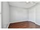 Bedroom with wood floors, ceiling fan and double door closet at 6213 Venezia Pl, Riverview, FL 33578
