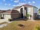 Two-story home with attached garage and landscaping at 6213 Venezia Pl, Riverview, FL 33578