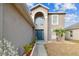 Two-story house with a dark blue door and landscaping at 6213 Venezia Pl, Riverview, FL 33578