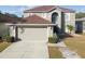 Two-story house with attached garage. Well maintained at 6213 Venezia Pl, Riverview, FL 33578