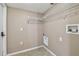 Laundry room with overhead shelving and utility hookups at 6213 Venezia Pl, Riverview, FL 33578