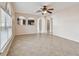 Spacious living room with tile floors and ceiling fan at 6213 Venezia Pl, Riverview, FL 33578