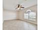Living room with tile floors, ceiling fan and window at 6213 Venezia Pl, Riverview, FL 33578