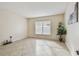 Bright living room with tile floors and large window at 6213 Venezia Pl, Riverview, FL 33578