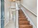 Entrance with staircase, tiled flooring, and view to the backyard at 6213 Venezia Pl, Riverview, FL 33578