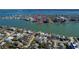 Stunning aerial view of luxury condos nestled along the tranquil waterfront, offering breathtaking water views at 736 Island Way # 606, Clearwater Beach, FL 33767