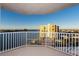 Balcony view of waterfront and cityscape, with modern white railings at 736 Island Way # 606, Clearwater Beach, FL 33767
