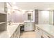 Elegant bathroom featuring double vanity, marble countertops and tiled floors, providing a spa-like feel at 736 Island Way # 606, Clearwater Beach, FL 33767