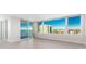 Bedroom with floor-to-ceiling window and sliding glass doors to a balcony at 736 Island Way # 606, Clearwater Beach, FL 33767