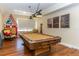 Spacious game room with a classic billiard table, charming decor, and ample natural light at 736 Island Way # 606, Clearwater Beach, FL 33767