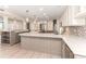 Modern kitchen with large island, stainless steel appliances, mosaic backsplash, modern cabinets, and pendant lighting at 736 Island Way # 606, Clearwater Beach, FL 33767