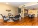 Inviting lounge area with comfortable wicker seating, stylish decor, and rich hardwood flooring at 736 Island Way # 606, Clearwater Beach, FL 33767