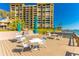 Outdoor dining area offering comfortable seating, a serene waterfront view, and ample space at 736 Island Way # 606, Clearwater Beach, FL 33767