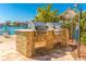 Outdoor kitchen equipped with premium built-in grills, and a charming waterfront view at 736 Island Way # 606, Clearwater Beach, FL 33767