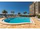 Inviting pool area offering clear blue waters, poolside seating, and lovely views at 736 Island Way # 606, Clearwater Beach, FL 33767