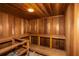 Relaxing cedar sauna featuring built-in benches, wood paneled walls, and overhead lighting at 736 Island Way # 606, Clearwater Beach, FL 33767