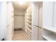 Organized walk-in closet with shelves, drawers, and hanging rods providing ample storage at 736 Island Way # 606, Clearwater Beach, FL 33767