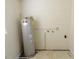 Utility area featuring a standard water heater at 816 W 130Th Ave, Tampa, FL 33612
