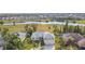 Aerial view of two-story house with golf course and lake views at 924 Bunker View Dr, Apollo Beach, FL 33572