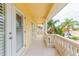 Balcony with white columns and french doors at 924 Bunker View Dr, Apollo Beach, FL 33572