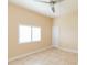 Bright bedroom with ceiling fan and tile floors at 924 Bunker View Dr, Apollo Beach, FL 33572