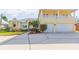 Two-story house with a large driveway, two-car garage, and balcony at 924 Bunker View Dr, Apollo Beach, FL 33572