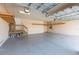 Garage with overhead storage and stairs at 924 Bunker View Dr, Apollo Beach, FL 33572