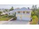 Two-story house with a double garage and landscaped yard at 924 Bunker View Dr, Apollo Beach, FL 33572