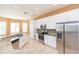 Modern kitchen with white cabinets, granite counters, and stainless steel appliances at 924 Bunker View Dr, Apollo Beach, FL 33572