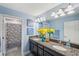 Elegant bathroom with double sinks and granite countertops at 9928 Ivory Dr, Ruskin, FL 33573
